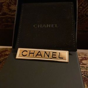 CHANEL metal gold with white enamel trim and Chanel signature brooch 2021